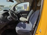a yellow truck with a black seat and a gray seat cover