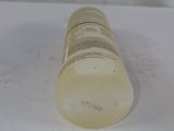 an empty bottle of liquid sitting on top of a white surface