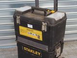 a black and yellow tool box on a cart