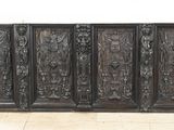 a large wooden cabinet that has carvings on it