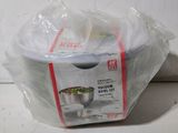 a bag of food sitting on a counter next to a bowl