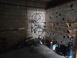 a bike hanging on a wall in a garage