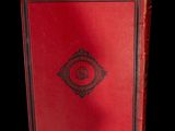 an old red book with a black border and a black and red cover