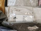 a lot of clothes that are packed in a suitcase
