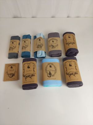many rolls of towels on a white surface