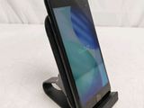a cell phone that is sitting on a stand