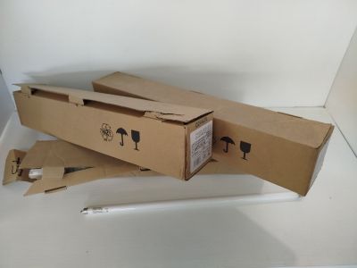 a cardboard box that has a pen in it