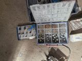 a tool box filled with assorted tools on the floor
