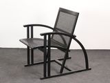 a black chair and a black chair in a room