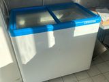 a white and blue washing machine in a bathroom