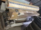 a stack of boxes and a tire in a garage