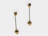 a pair of gold earrings on a white background