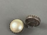 an image of a pair of earrings with pearls on them