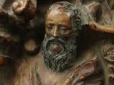 a bronze statue of a man with a beard and bearding