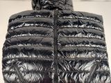 a close up of a black down jacket with a hood
