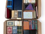 boxes of books are stacked on top of each other on a white surface
