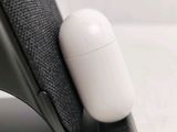 a close up of an apple airpods sitting on top of a table