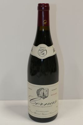 a bottle of wine that is sitting on a table