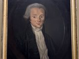 portrait d'un homme en manteau noir et chemise blanche