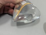 a person that is holding a glass with something in it