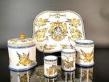 four cups and a tray with a design on it