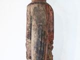 a wooden statue that is sitting on a table