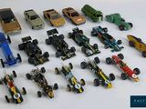 a lot of toy cars that are on a table