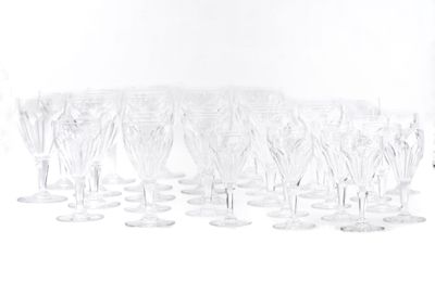 a lot of wine glasses that are sitting on the table