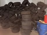 a pile of tires stacked on top of each other in a garage