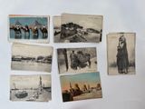 many old photos of people riding horses on the beach