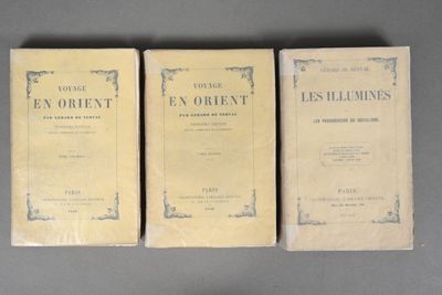 three books sitting on top of a table next to each other