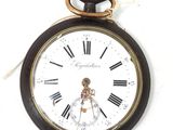une horloge avec des chiffres romains sur le cadran