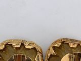 two pairs of gold tone cuff earrings with a pearl in the center
