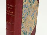 a red book with a floral design on it