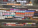many books in a metal cage on a shelf