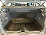 a trunk of a car with the back door open