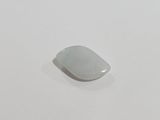a white piece of glass sitting on a white surface