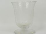 clear glass wine goblet sitting on a white surface