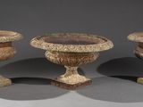 three vases sitting next to each other on a table