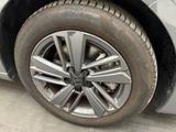 a close up of a tire on a white car
