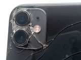a broken iphone that is sitting on a table