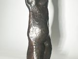 statue of a bear on a black base with a white background