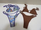 two pieces of swimwear are laying out on a white surface