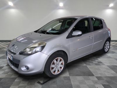a picture of a silver car parked in a garage