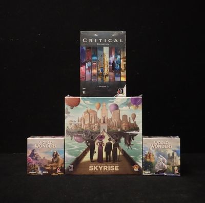 a lot of games on display on a black table