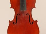 an old violin with a bow hanging from it ' s back