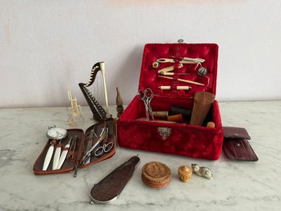 a red case filled with various tools on a table