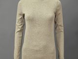 a woman ' s beige sweater on a mannequin mannequin mannequin mannequin mann
