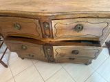 a wooden table with two drawers and a chair