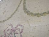a painting on the wall of a room with a flower on it